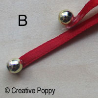 Ruban décoration Noël avec double noeud et embouts perles - étape B